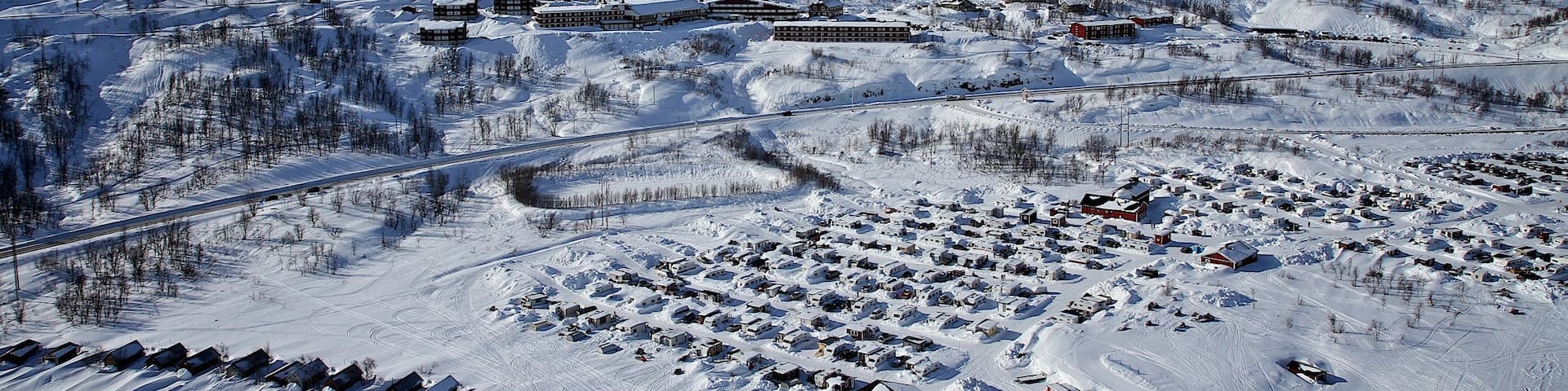 Riksgransen showing snow and a small town or village