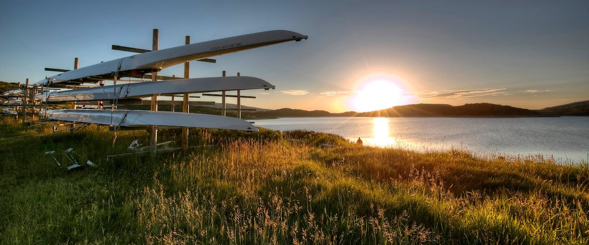 Falls Creek que incluye una puesta de sol y un río o arroyo