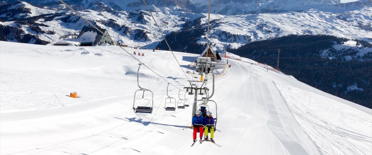 Corvara in Badia featuring mountains, a gondola and snow