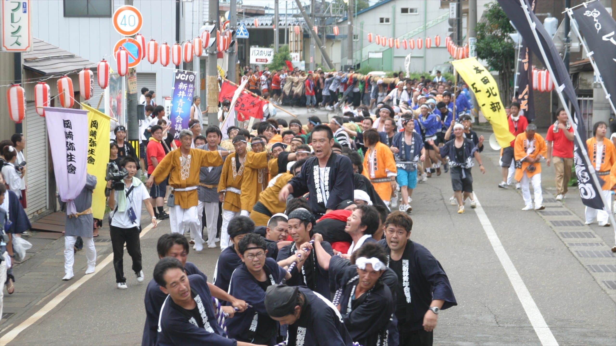 Myoko showing a festival and street scenes as well as a large group of people