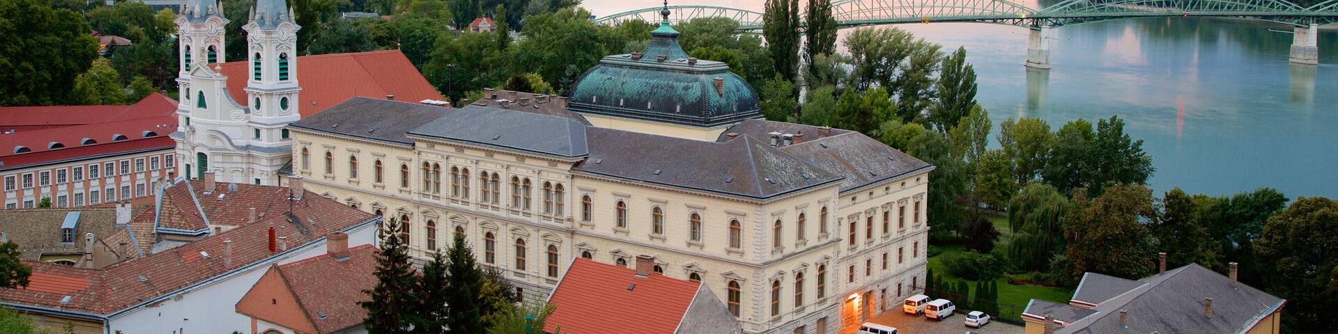 Esztergom showing a bridge, a church or cathedral and a sunset