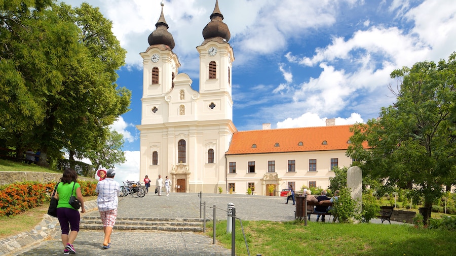 Tihany Abbey showing heritage architecture and a church or cathedral as well as a couple