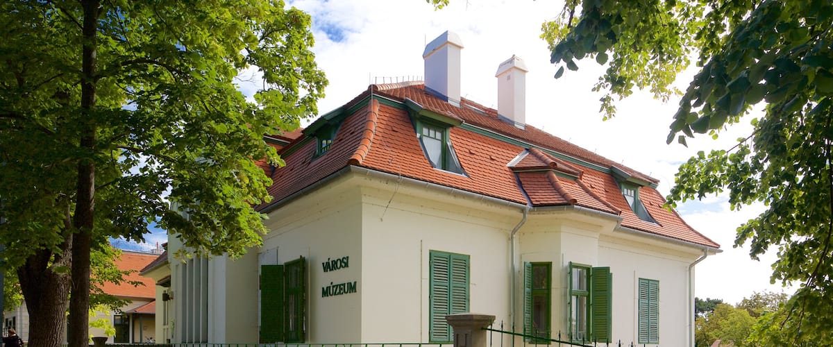 Balatonfured which includes signage and general coastal views
