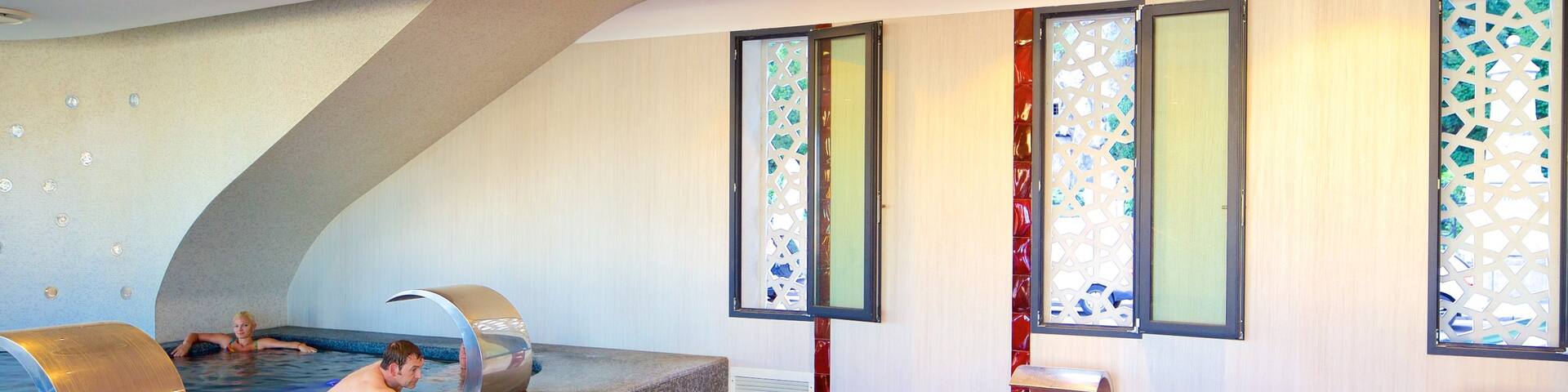 Rudas Baths featuring a day spa, a pool and interior views