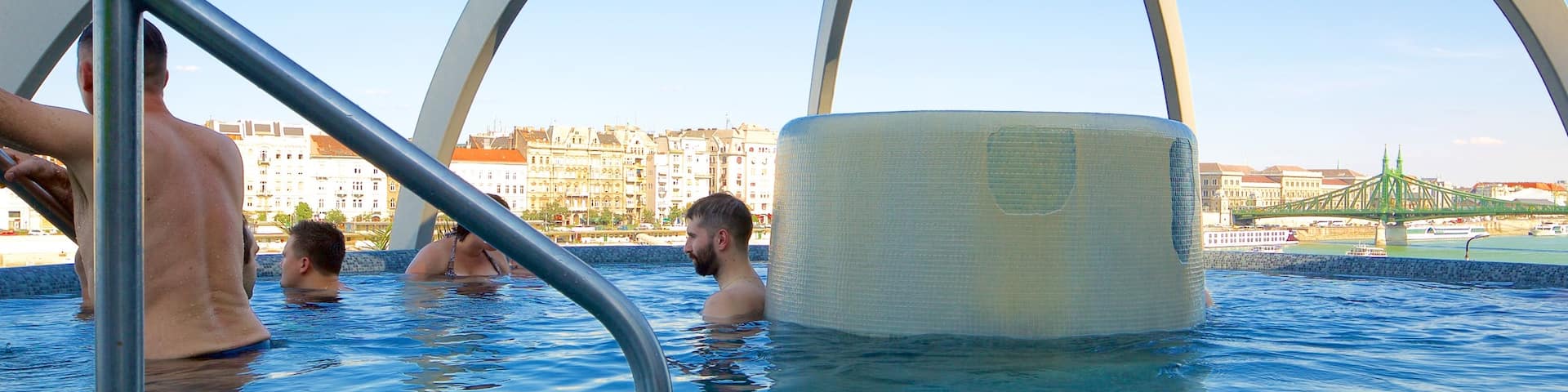 Rudas Baths showing a day spa as well as a small group of people