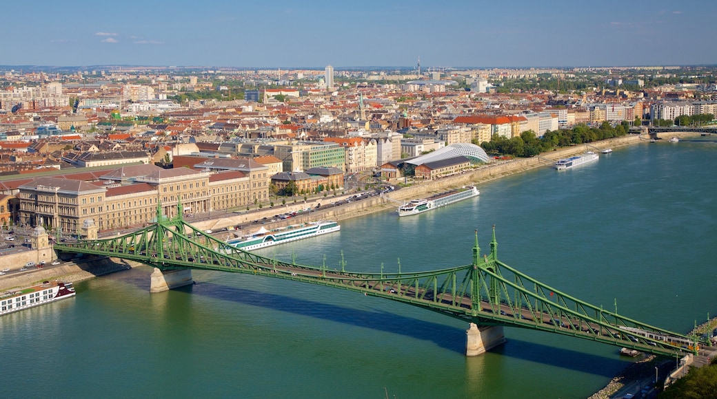 Liberty Bridge showing a ferry, a bridge and a city