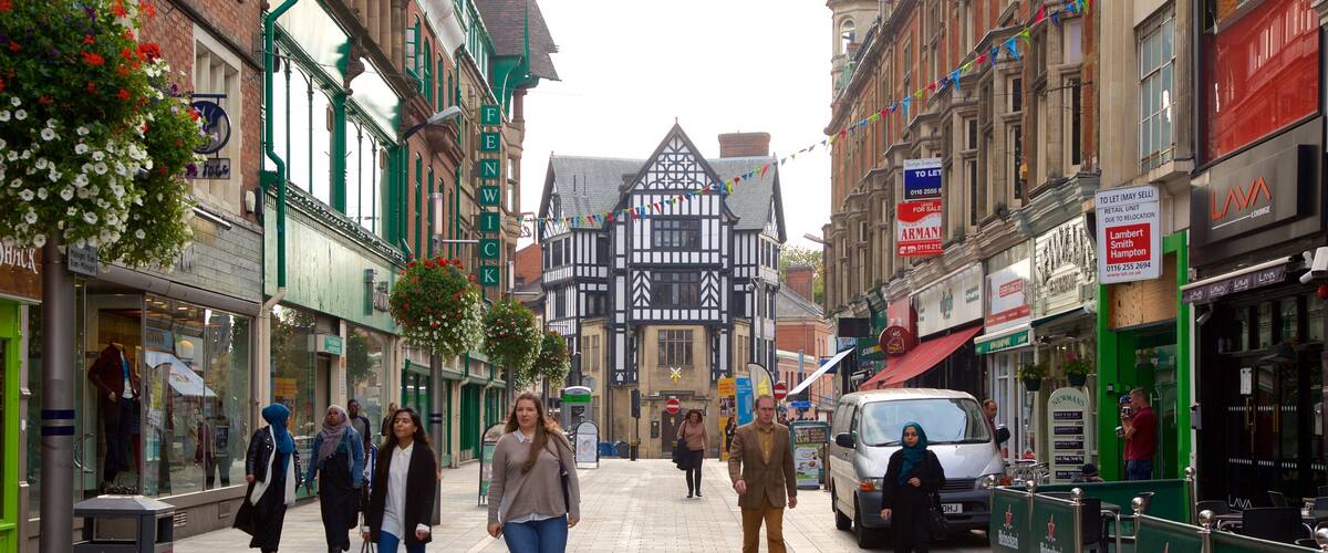 Leicester featuring a city and street scenes as well as a small group of people