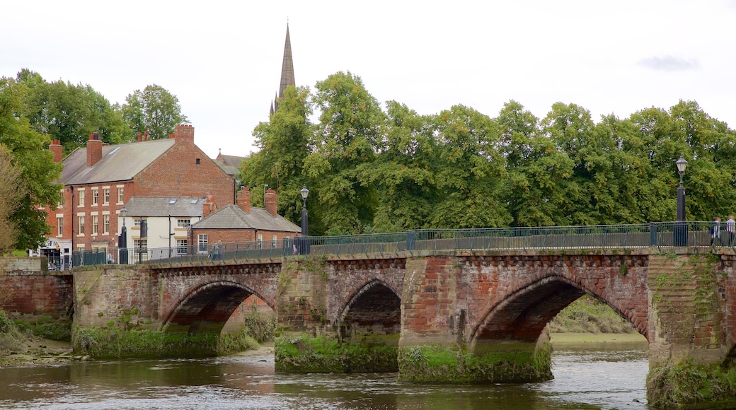 Old Dee Bridge which includes a river or creek, a bridge and heritage elements