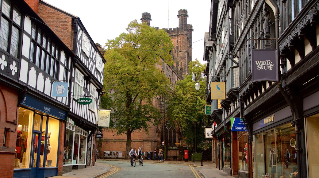 Chester Cathedral showing road cycling, a church or cathedral and signage