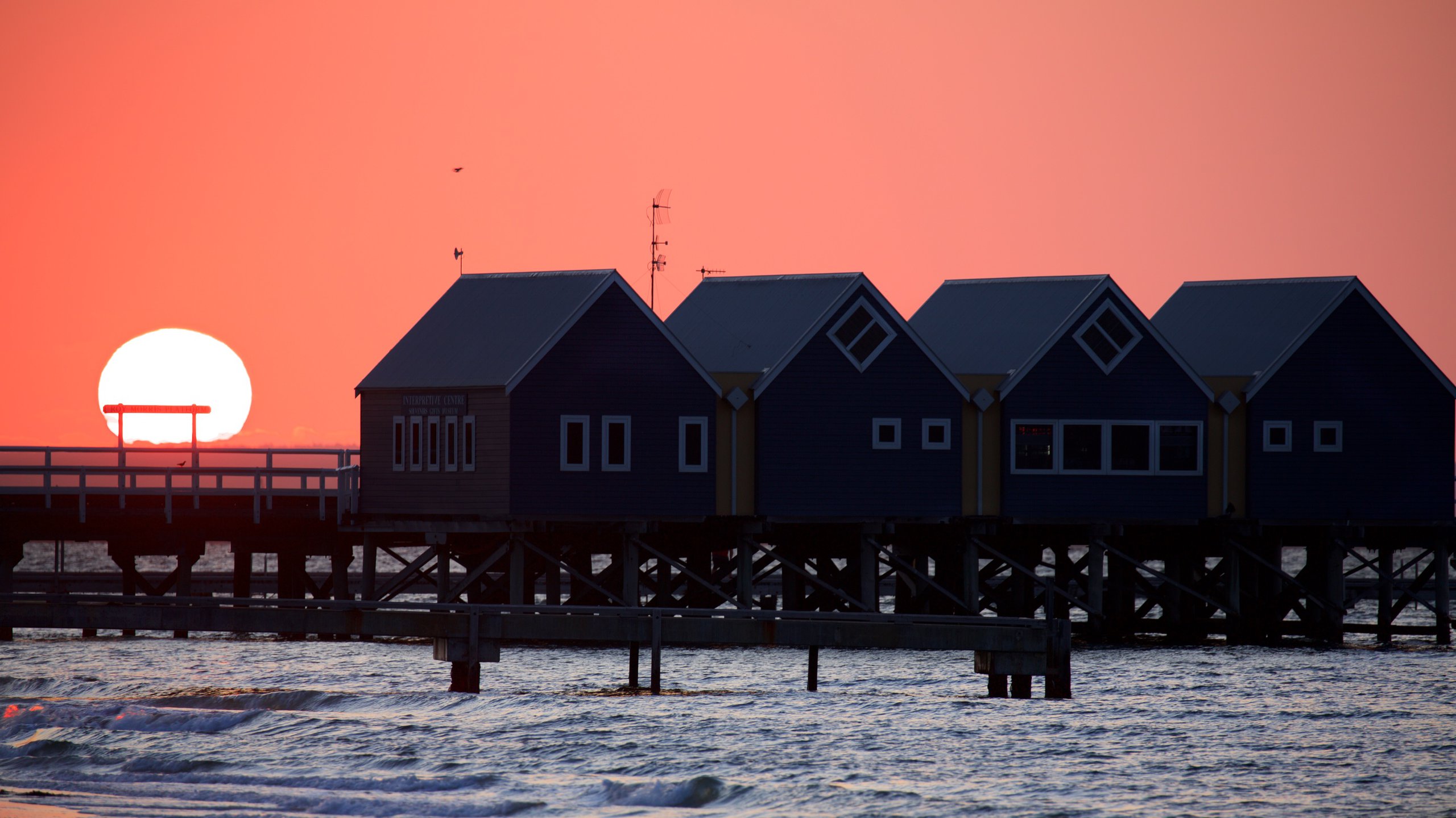 Busselton Jetty which includes general coastal views and a sunset