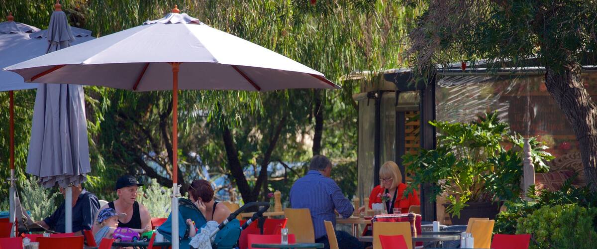 Dunsborough showing a park and outdoor eating as well as a small group of people
