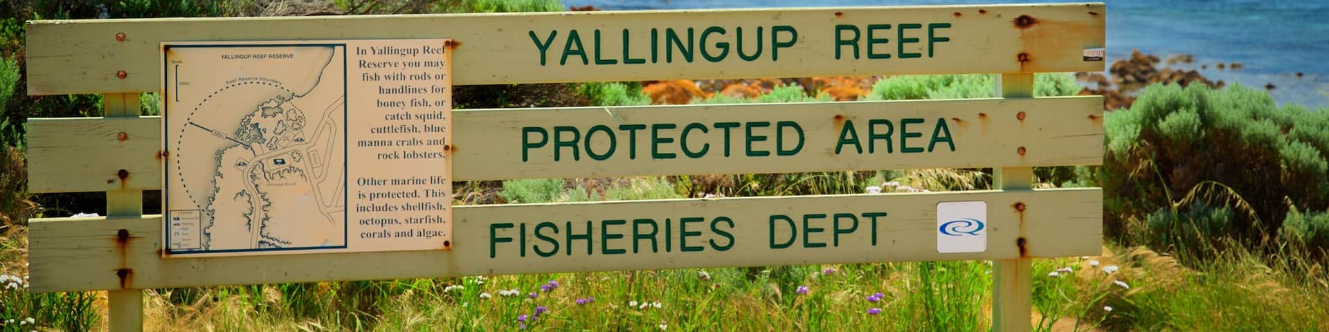 Yallingup which includes rugged coastline and signage