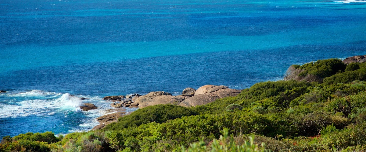 Conto Beach which includes a sandy beach and rocky coastline