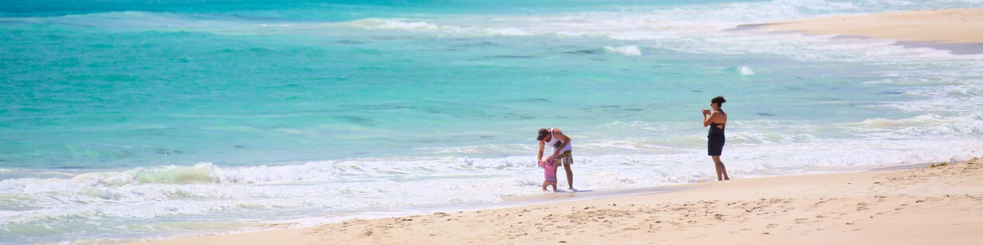 Bunker Bay showing a bay or harbor and a sandy beach as well as a family