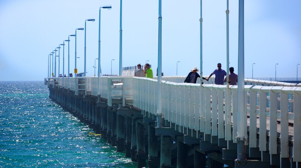 Busselton Jetty which includes general coastal views as well as a small group of people