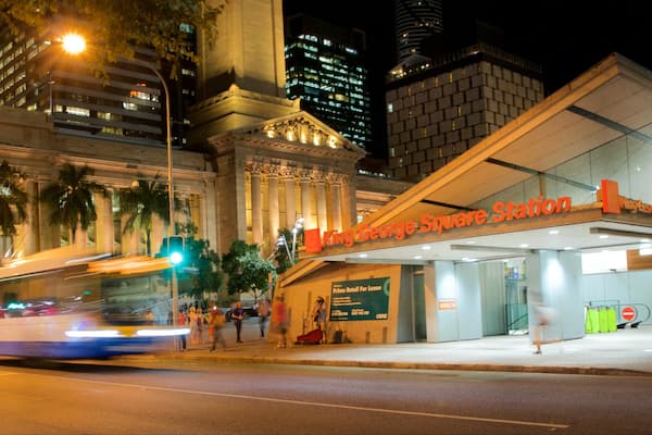 King George Square which includes a city, night scenes and street scenes