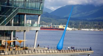 Vancouver Waterfront which includes a bay or harbor and outdoor art