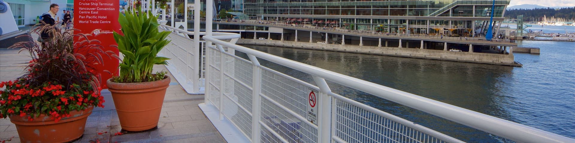 Canada Place which includes modern architecture, a city and a bay or harbor