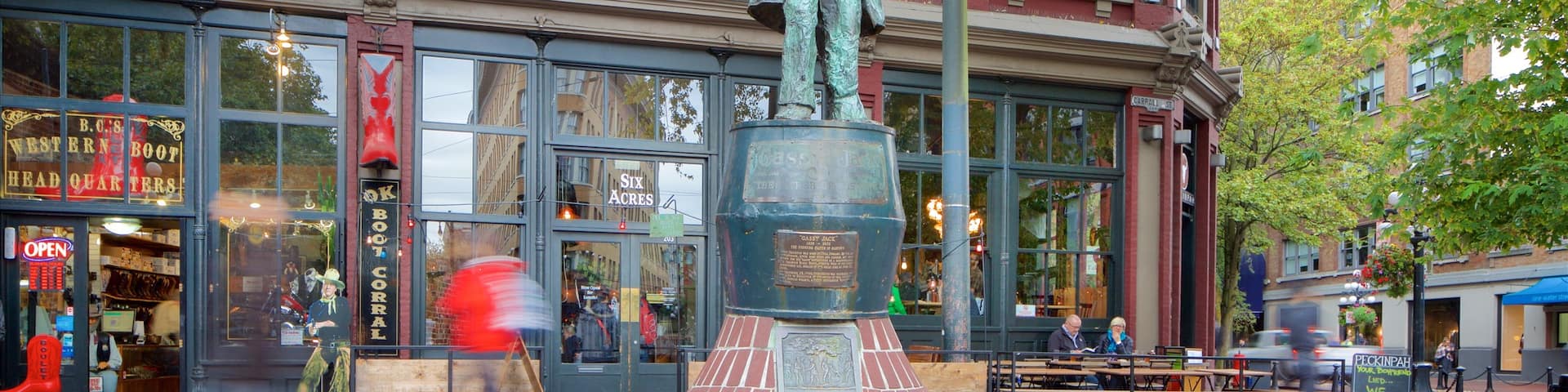 Gastown featuring heritage architecture, a statue or sculpture and street scenes