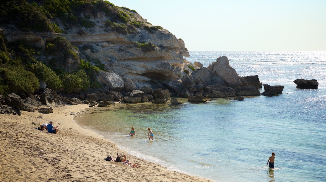 Prevelly Beach showing a sandy beach, a bay or harbour and rocky coastline