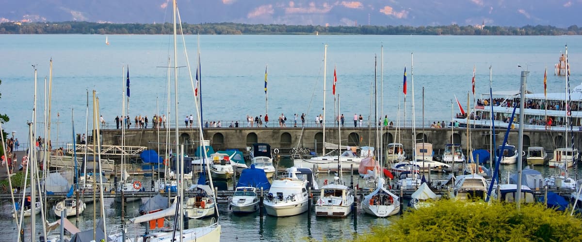Lindau which includes mountains, a sunset and a bay or harbor
