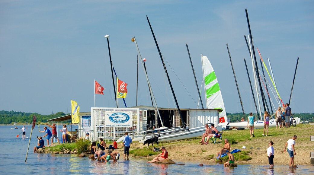 Cospudener Lake showing a lake or waterhole as well as a small group of people