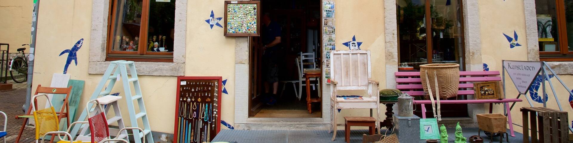 Kunsthof-Passage which includes a house, street scenes and outdoor art
