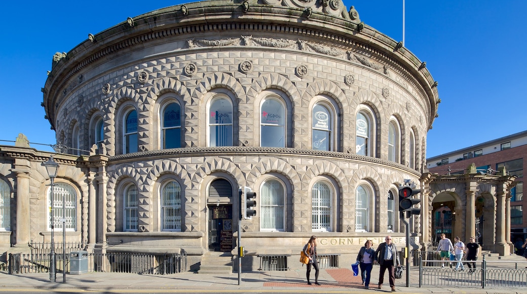 Corn Exchange featuring street scenes and heritage architecture as well as a small group of people
