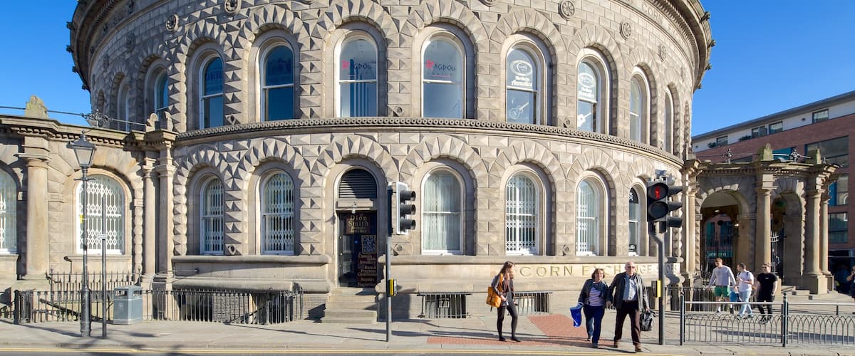 Corn Exchange featuring street scenes and heritage architecture as well as a small group of people