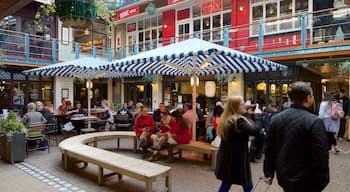 Carnaby Street which includes a square or plaza as well as a large group of people