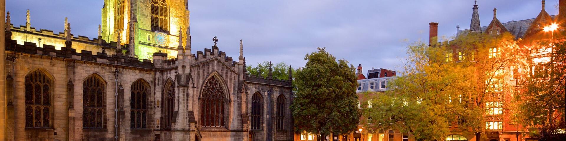 Sheffield Cathedral which includes night scenes, a church or cathedral and street scenes