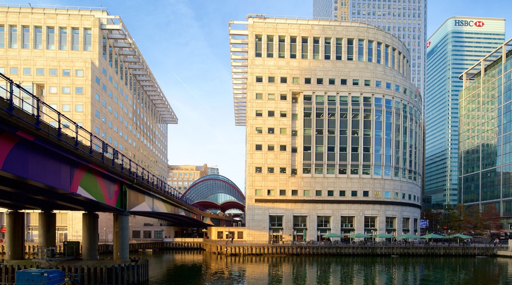 Canary Wharf showing a river or creek, a bridge and central business district