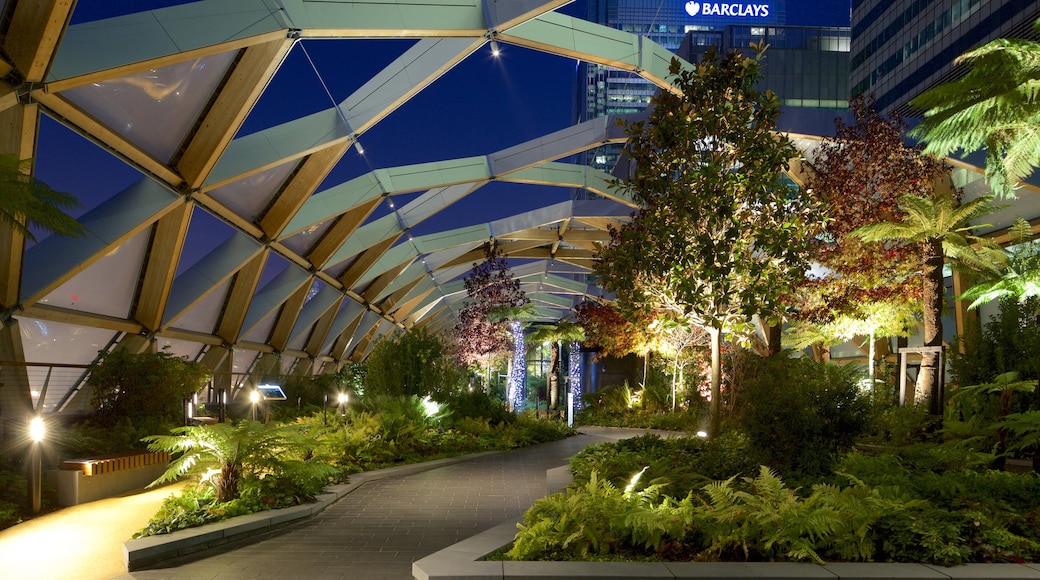 Canary Wharf - Docklands which includes night scenes and a park