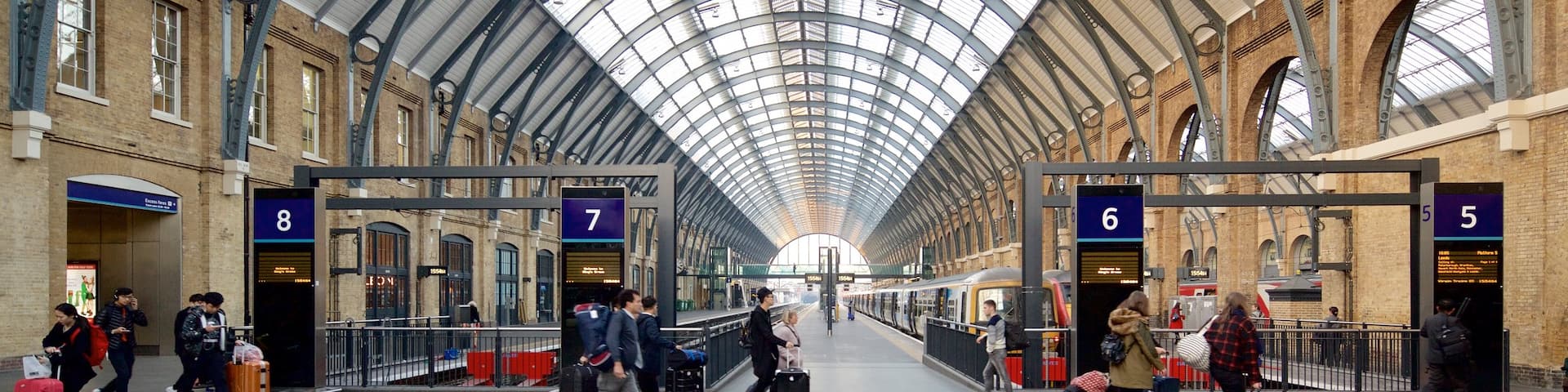 Kings Cross St. Pancras showing interior views and heritage architecture as well as a small group of people