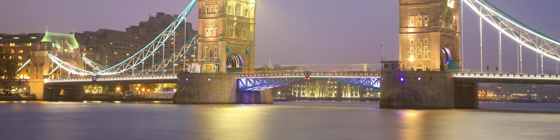 Tower Bridge which includes night scenes, heritage architecture and a river or creek