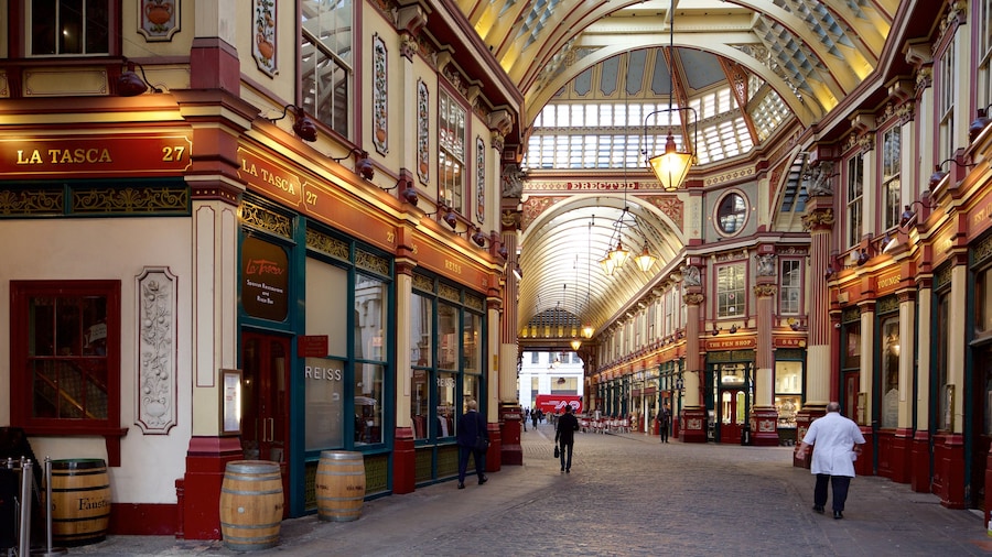Interior view of Leadenhall Market with ornate Victorian architecture.
