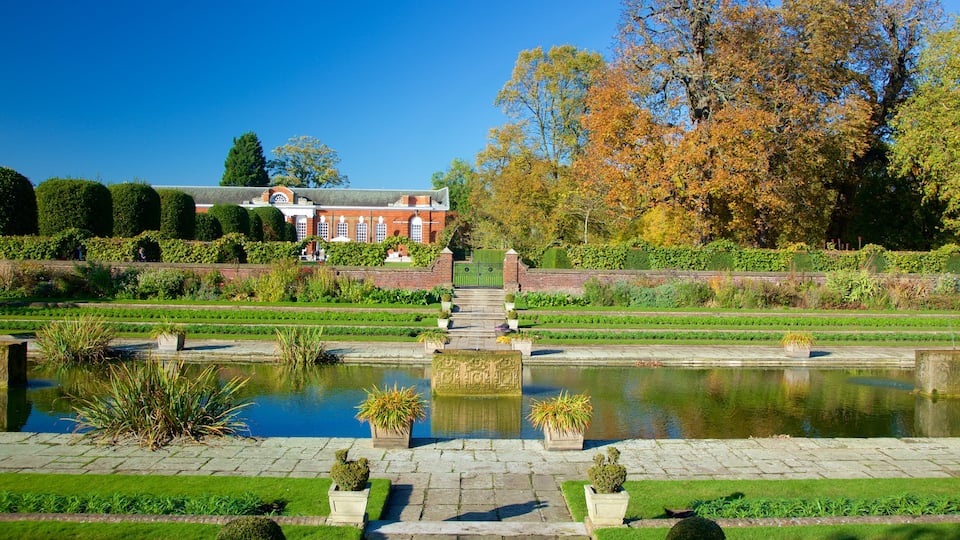 Kensington Palace featuring a garden, chateau or palace and a pond
