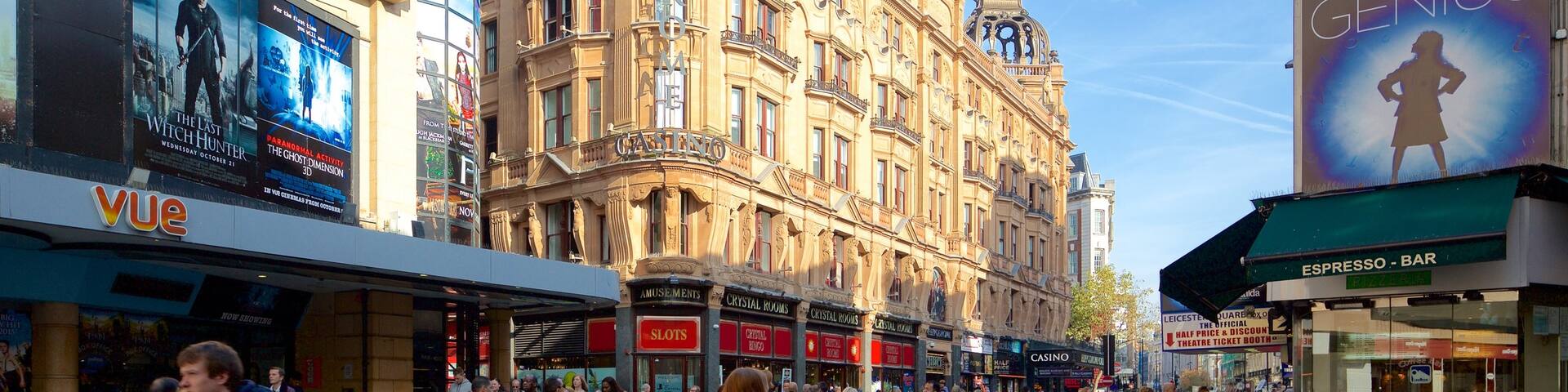 Leicester Square showing café scenes, heritage architecture and street scenes