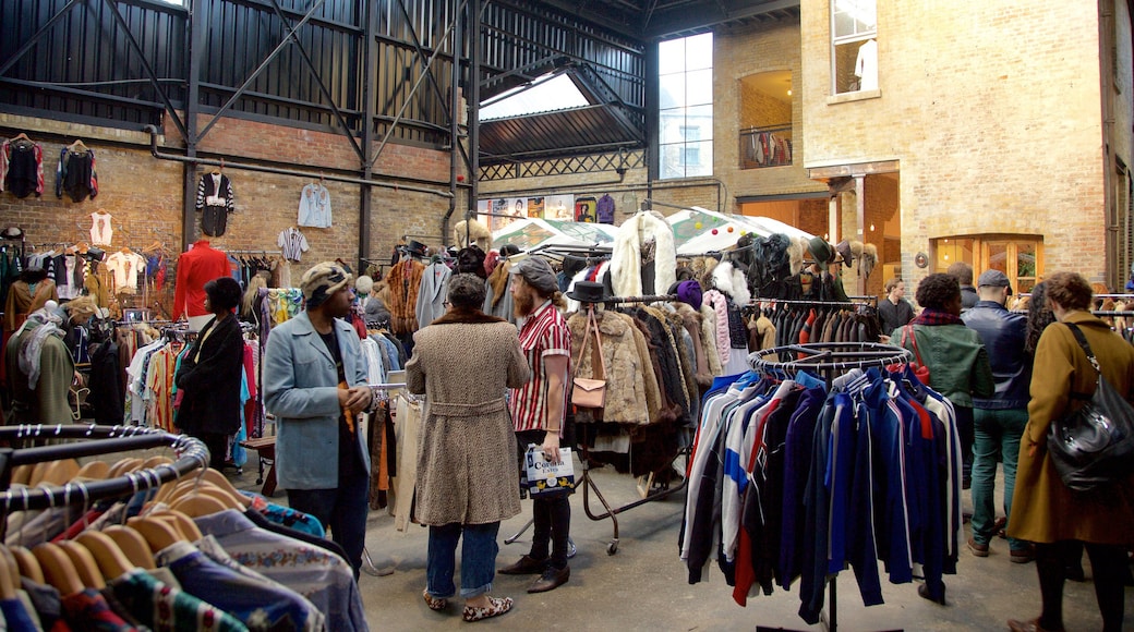 Old Spitalfields Market featuring markets and shopping as well as a small group of people