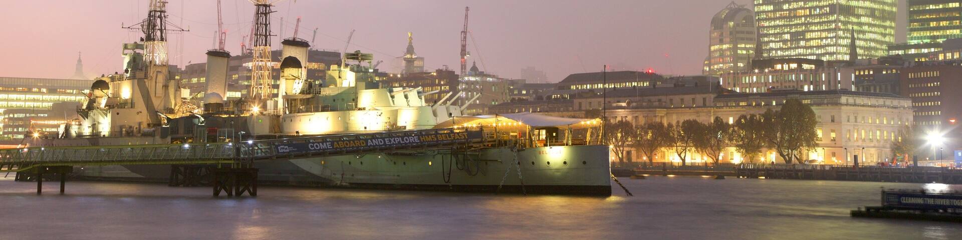 HMS Belfast which includes a skyscraper, night scenes and a river or creek