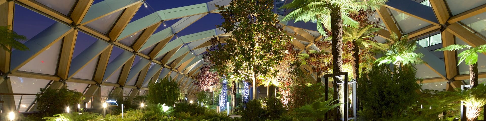 Canary Wharf which includes night scenes, interior views and a park