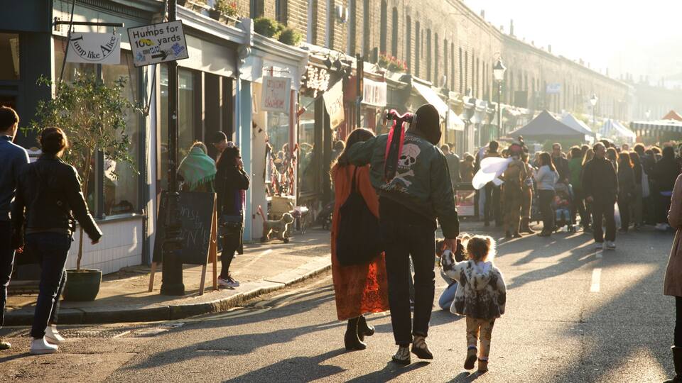 London featuring markets and street scenes as well as a family