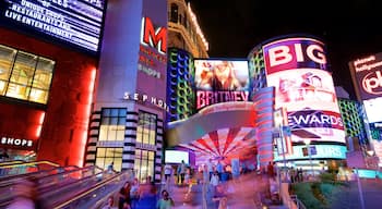 Miracle Mile Shops which includes night scenes, signage and a casino