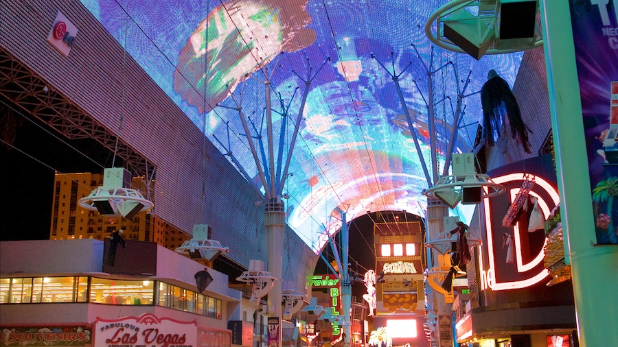 Fremont Street Experience which includes outdoor art, signage and night scenes