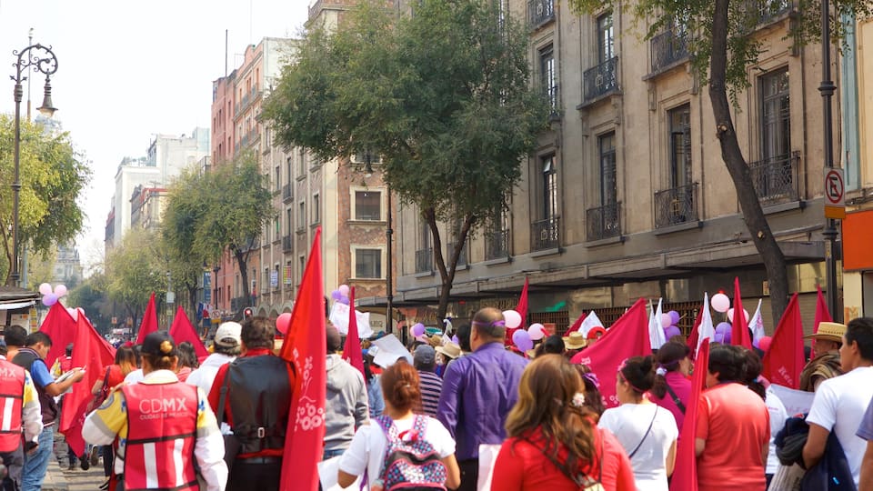 Downtown Mexico City showing a city and a festival as well as a large group of people