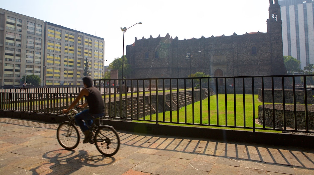 Plaza de las Tres Culturas which includes cycling, a garden and heritage architecture