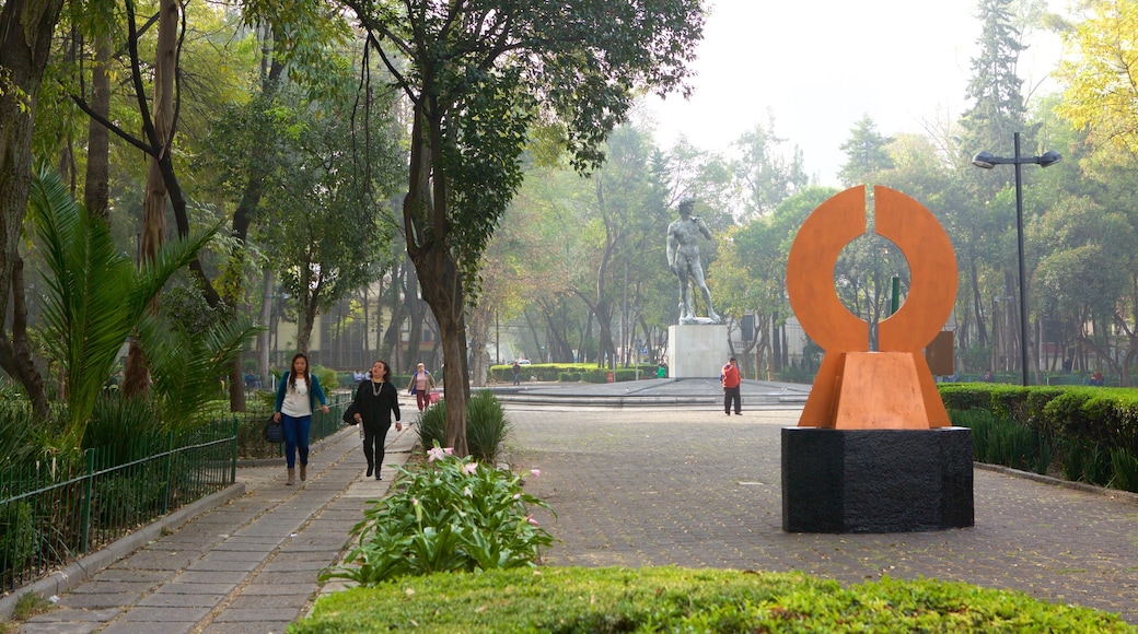 La Condesa showing a square or plaza, a garden and a statue or sculpture