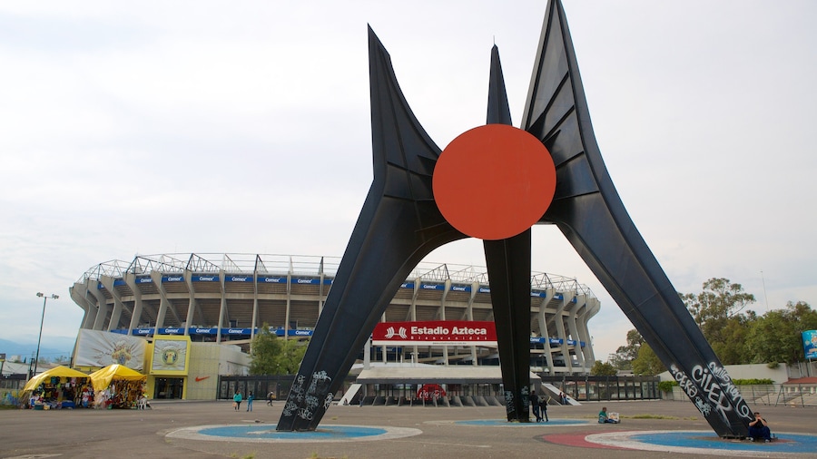 Estadio Azteca showing a square or plaza and a statue or sculpture
