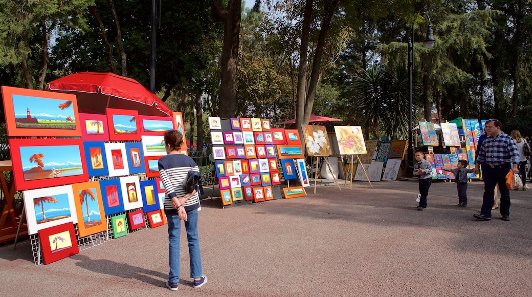 San Jacinto Plaza which includes a garden and markets as well as a small group of people