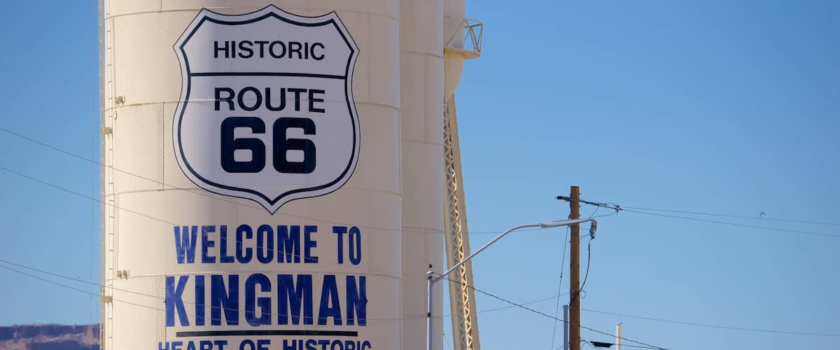 Kingman which includes desert views, signage and tranquil scenes